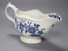 An 18th century Worcester sauceboat decorated with the Early Flowering Plants pattern, length