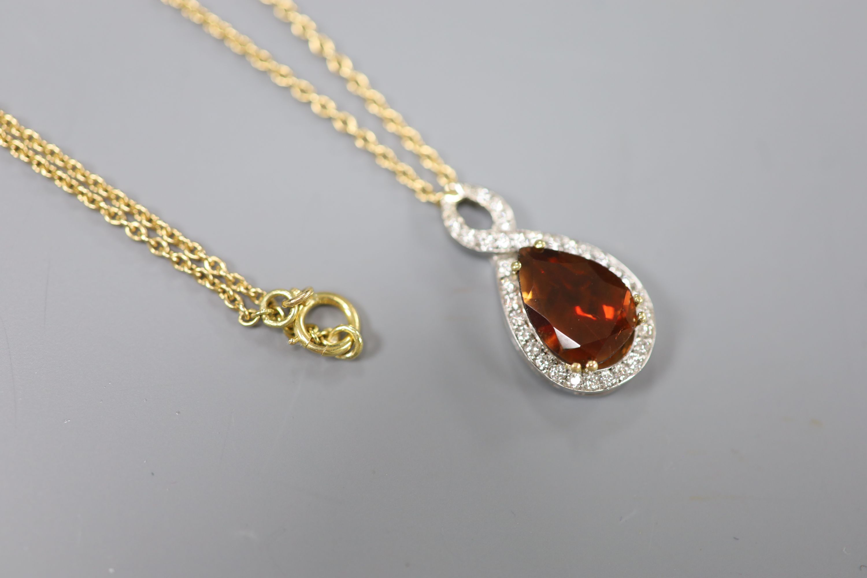 A white and yellow metal, garnet and diamond set teardrop shaped pendant necklace, pendant 29mm, - Image 2 of 4