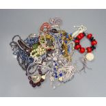 A group of assorted costume jewellery, including coloured paste necklaces.