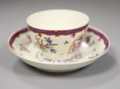 An 18th century Worcester teabowl and saucer painted Companie des Indes style with flowers in a