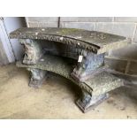 A pair of reconstituted stone curved garden bench seats, length 160cm, width 40cm, height 42cm