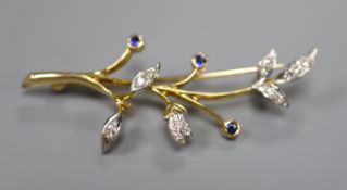 A 1960's 18ct gold, sapphire and diamond set foliate spray brooch, 54mm, gross 6.7 grams.