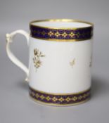 A 19th century Barr Worcester fine mug with a distinctive handle painted in under glaze blue and