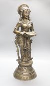 An Indian bronze figure of Deepalakshmi, (representation of the Hindu Goddess Lakshmi, symbol of