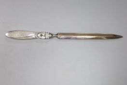 A George Jensen sterling handled paper knife, 21cm.CONDITION: A few very minor scratches to the