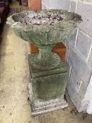 A reconstituted stone campana garden urn on pedestal, diameter 58cm, height 107cm