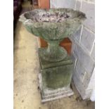 A reconstituted stone campana garden urn on pedestal, diameter 58cm, height 107cm