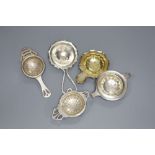 Five assorted 20th century silver tea strainers, 4oz.