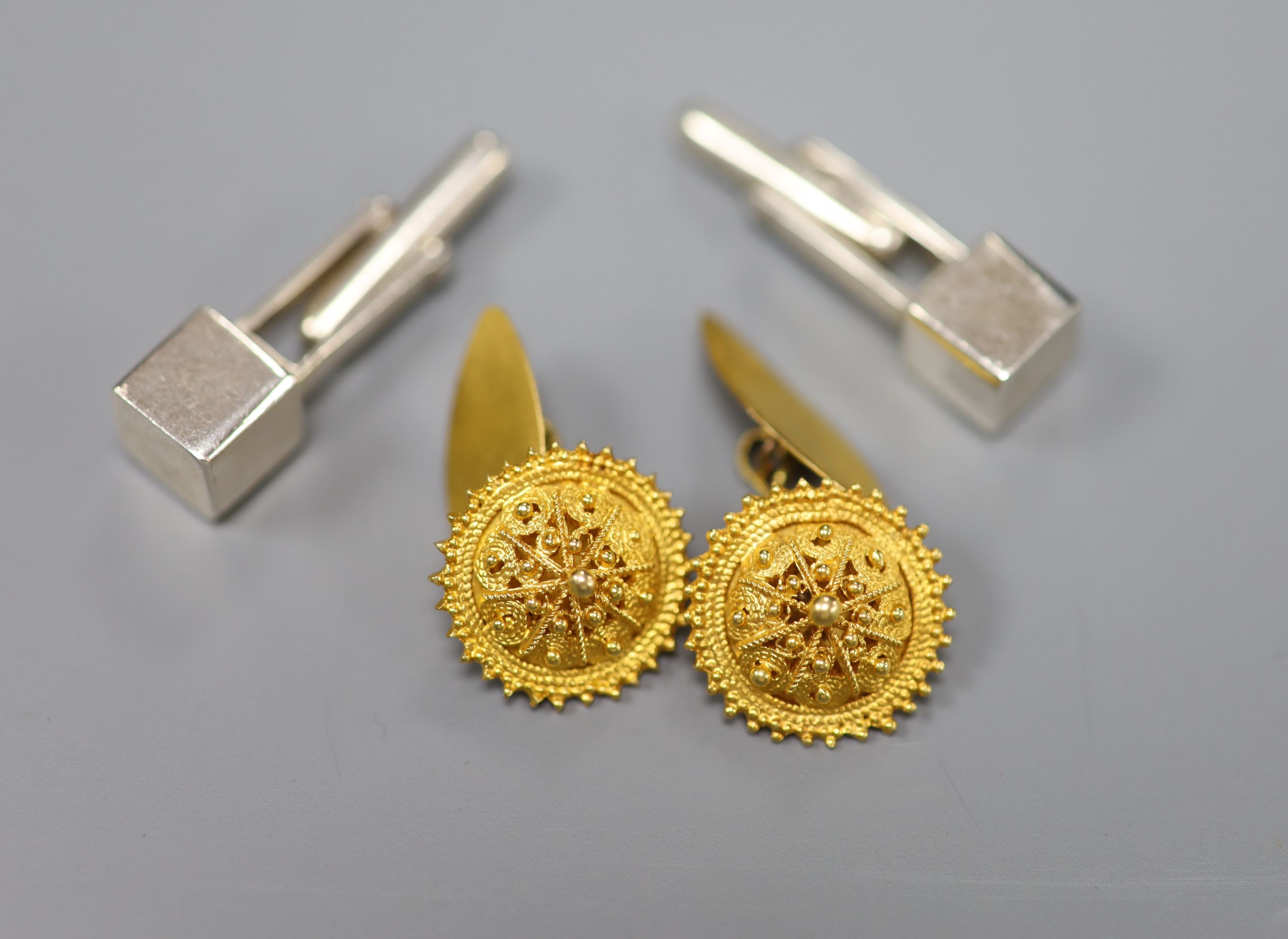 A pair of yellow metal cannetile work cufflinks, gross 6.8 grams and a pair of Peruvian Ilaria 950