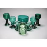 A group of 19th century green glass and a Victorian dump paperweightCONDITION: One of the dishes