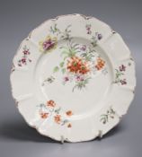 An 18th century Derby shaped plate painted with flower in the manner of the Cotton Stem painter,