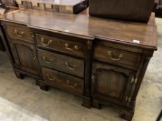 A George III style cross banded oak break front low dresser, width 50cm, depth 47cm, height 83cm