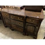 A George III style cross banded oak break front low dresser, width 50cm, depth 47cm, height 83cm