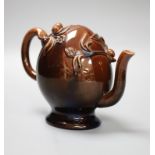 A small Brameld Cadogan teapot, relief moulded and gilded over a brown glaze, impressed mark, height