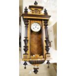 A 19th century German walnut wall clock, length 102cm