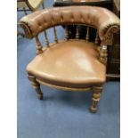 A Victorian oak tub framed library chair, upholstered in brown leather, width 60cm, depth 60cm,