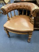 A Victorian oak tub framed library chair, upholstered in brown leather, width 60cm, depth 60cm,