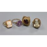 A Renaissance style cabochon garnet ring, 9ct gold stepped pierced setting, 7.2g and three other 9ct