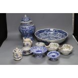 A group of Asian ceramics including a Kangxi blue and white cup and a pair of Chinese enamelled oval