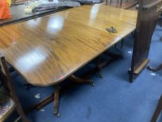 A George III style mahogany twin pedestal dining table, with two spare leaves, length 175cm, depth