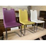 A set of eight contemporary stainless steel and leather-covered dining chairs
