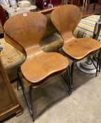 A set of four Jacobsen style bent-ply and tubular metal stacking dining chairs, width 44cm, depth