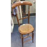 A Victorian beech cane seat correction chairCONDITION: Seat width 32cm depth 29cm height 100cm