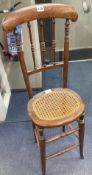 A Victorian beech cane seat correction chairCONDITION: Seat width 32cm depth 29cm height 100cm