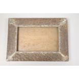 A silver-mounted rhino or elephant hide photo frame