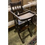 An early 20th century oak and beech child's metamorphic high chair