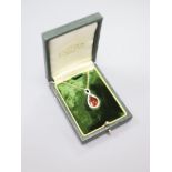 A white and yellow metal, garnet and diamond set teardrop shaped pendant necklace, pendant 29mm,