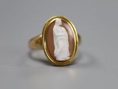 A 19th century yellow metal and oval cameo hardstone ring, carved with the figure of a lady with