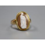 A 19th century yellow metal and oval cameo hardstone ring, carved with the figure of a lady with