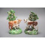 A 19th century Derby pair of cow and calf groups, height 15cmCONDITION: Both with flowers and