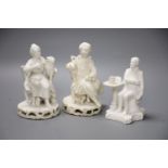 An early 19th century pair of Derby biscuit figures of a boy with a cat and a girl with a dog and