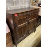 An 18th century panelled oak Livery cupboard (adapted), width 130cm, depth 57cm, height 128cm