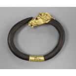 A continental yellow metal and gem set mounted wooden? bangle, with horse head terminal, gross 40