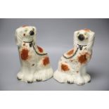 A pair of Staffordshire dogs, height 24cmCONDITION: Dog looking to his left - some repairs to his