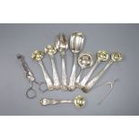 Seven various 19th century silver condiment spoons, a caddy spoon and two pairs of sugar nips