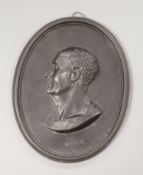 A Wedgwood & Bentley black basalt oval portrait plaque of Marius, length 12cm