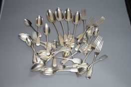 A harlequin set of George III and later silver crested fiddle pattern flatware, comprising twenty