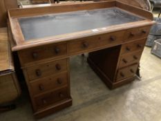 A Victorian mahogany pedestal desk, with a three quarter gallery top, width 122cm, depth 60cm,