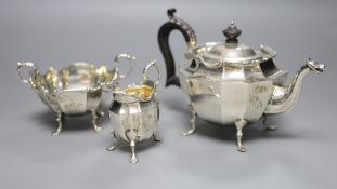 A late Victorian three-piece silver tea service of shaped stylised outline, J. R. Ltd, Birmingham