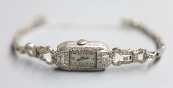 A lady's 1940's white metal (stamped platinum) and diamond set cocktail watch, on a platinum