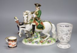 A Continental porcelain figure group, an overlaid glass goblet and a Royal Crown Derby miniature