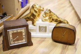 Two wooden Art Deco clocks and a ceramic clock modelled with lion cub