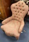 A Victorian button back nursing chair, with pink brocade upholstery, width 65cm, depth 55cm,