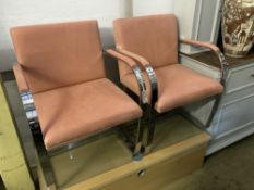 A pair of Knoll International BRNO chairs, after Mies Van De Rohe, upholstered in peach suede