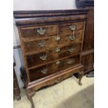 A mid 18th century walnut chest on stand, width 110cm depth 58cm height 142cm