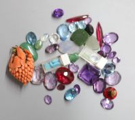 A small quantity of unmounted cut gemstones, including amethyst, aquamarine and synthetic blue
